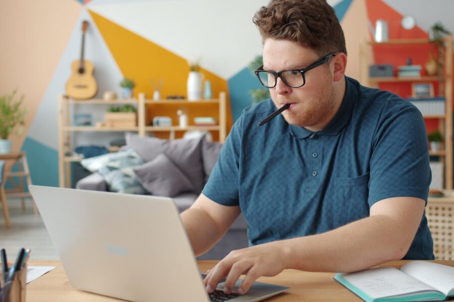 Student studying laptop notebook desk