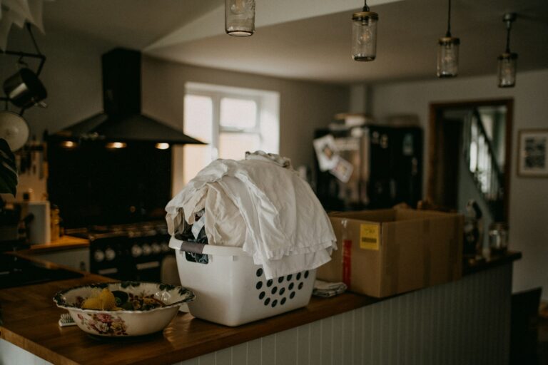 Organized kitchen counter sink folded laundry basket bed
