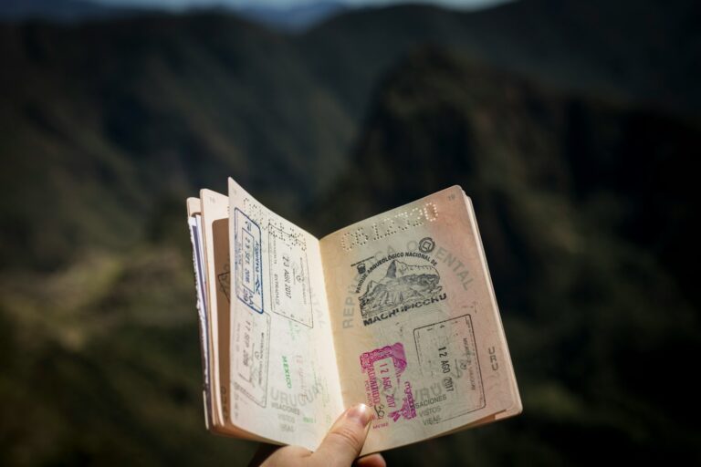 Traveler holding passport check printed travel documents passport