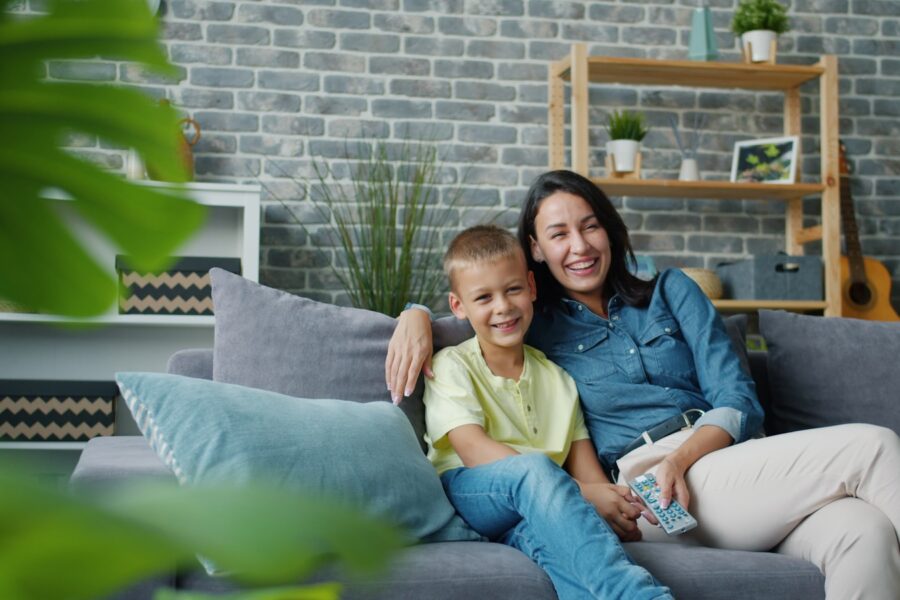 Family watching living room remote