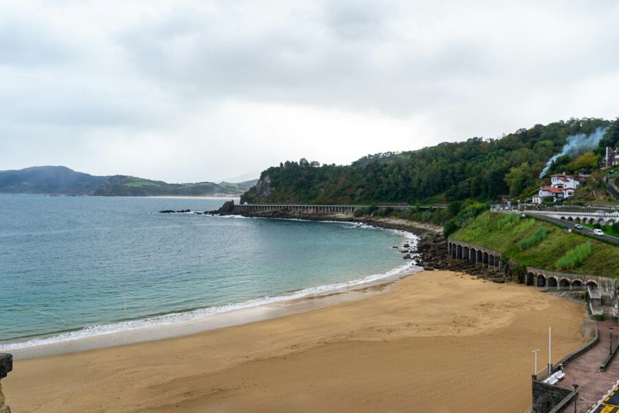 Coastal town train tracks sandy beach