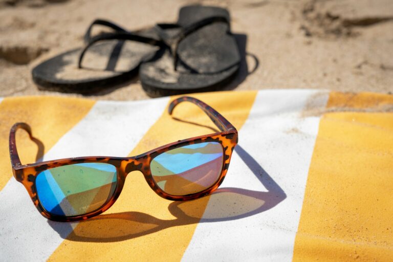 Weekend beach packing backpack towel sunglasses