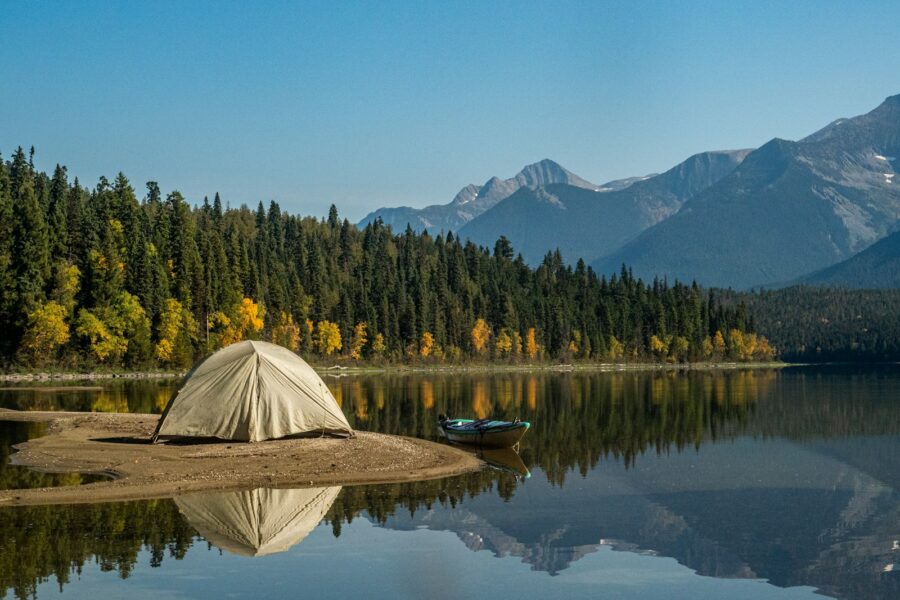 Hiker small tent forest lake