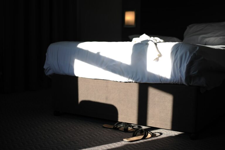 Open suitcase hotel room business casual clothes