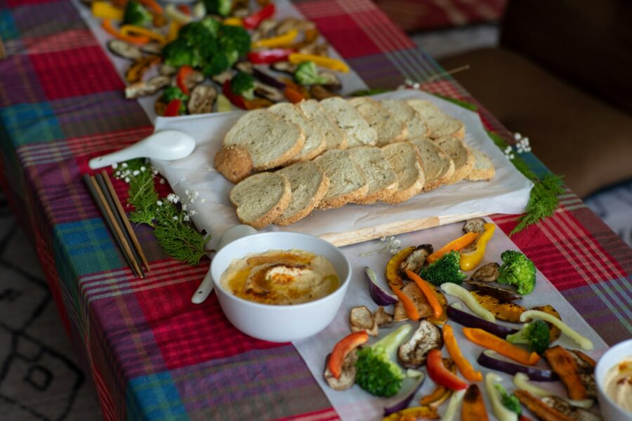Summer cook dinner plate vegetables bread hummus