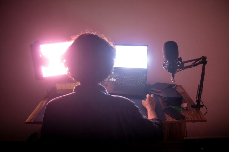 Video call person headphones webcam lighting setup