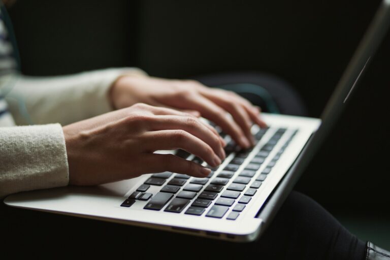 Person checking email inbox laptop
