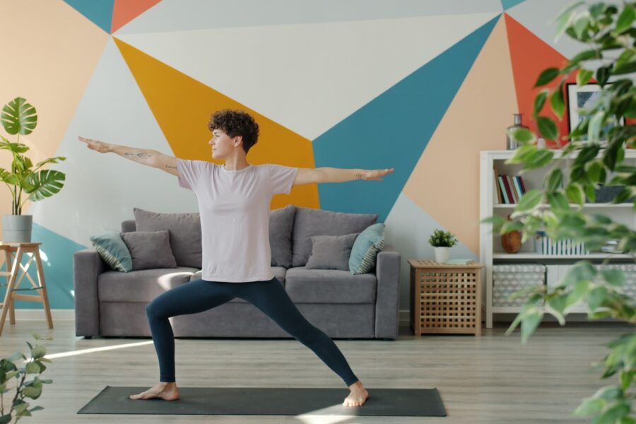 Person stretching living room after work