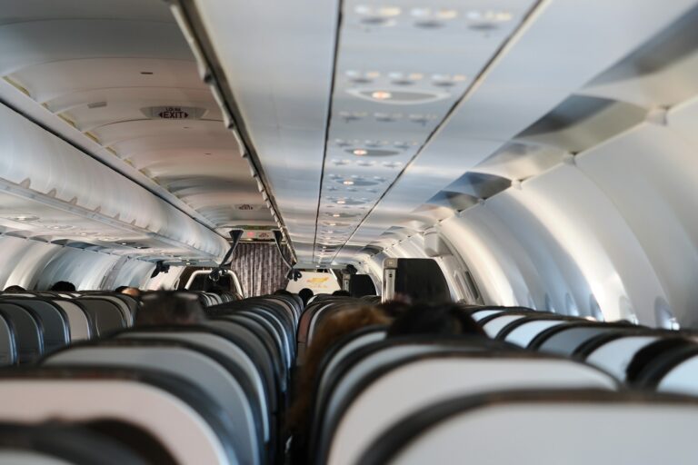 Airplane aisle passenger stretching legs