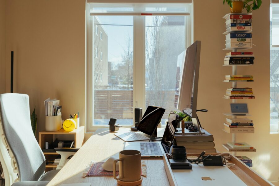 Office worker stretching desk computer window