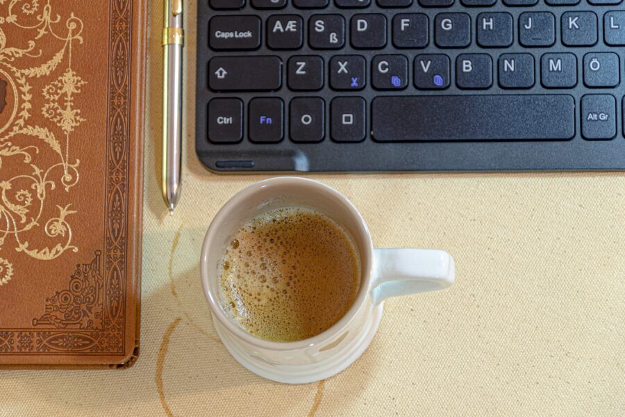 Notebook pen coffee desk