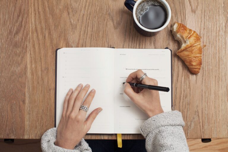 Person writing notebook