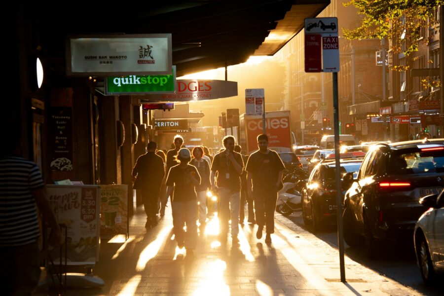 Person walking after work sunset city street