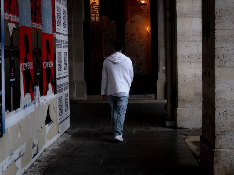 Person walking hallway casual clothes