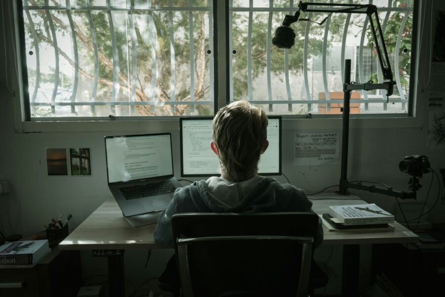 Person stretching desk window laptop chair