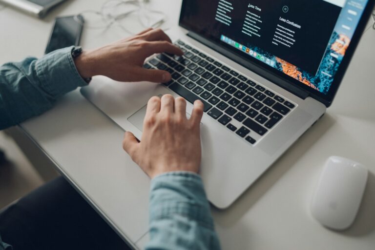 Person managing browser settings laptop