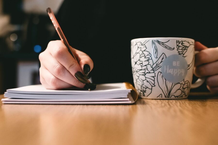 Person writing notebook