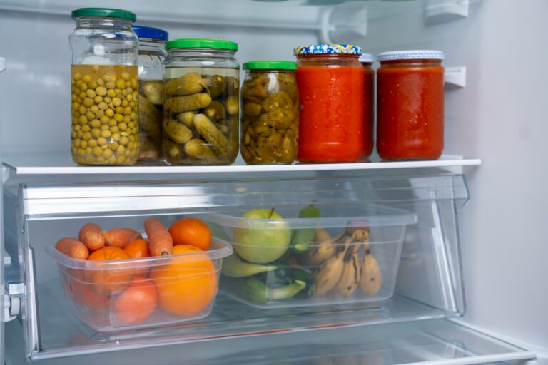 Hands cleaning refrigerator