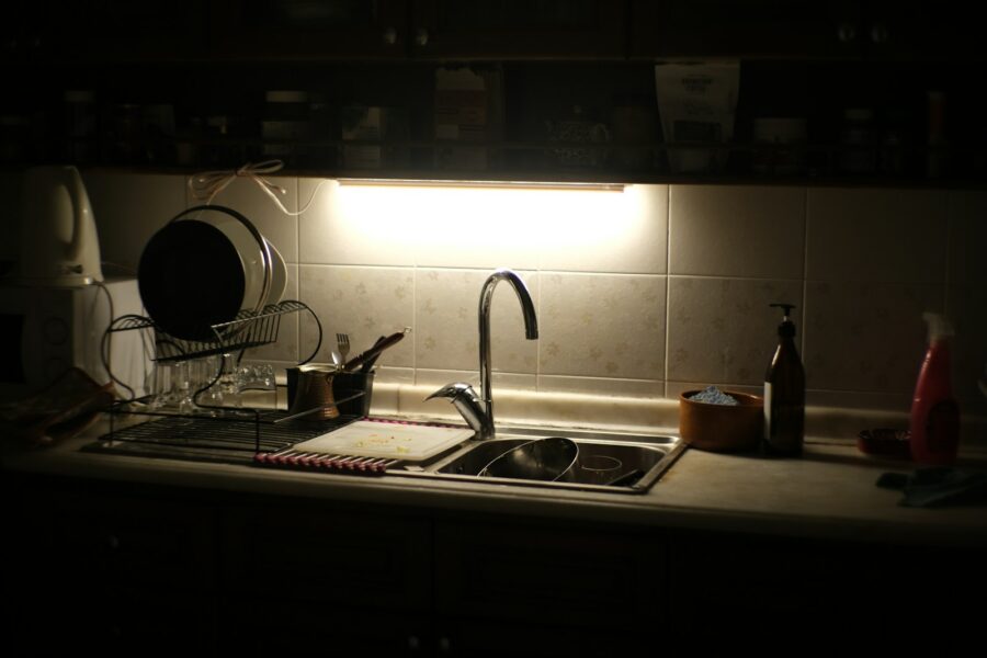 Tidy evening kitchen counters sink light