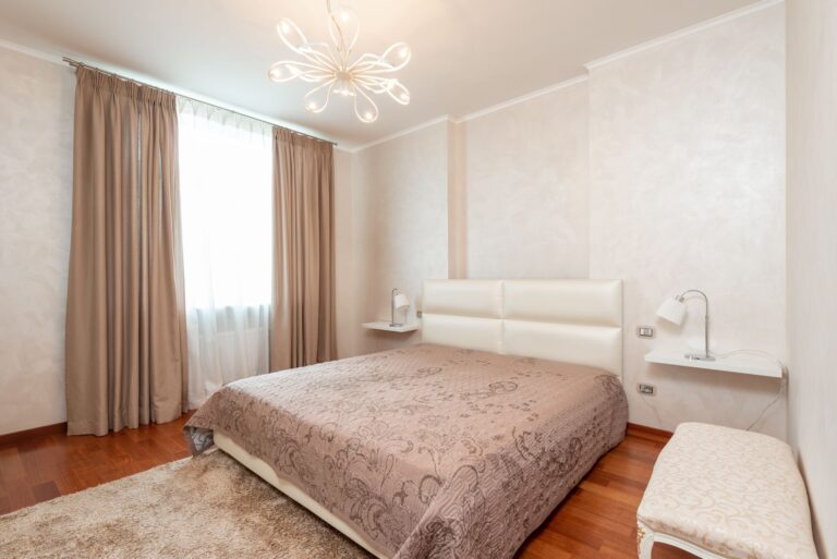 Quiet bedroom thick curtains bedside lamp hallway rug