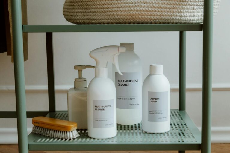Folded laundry baskets bed laundry detergent bottles shelf