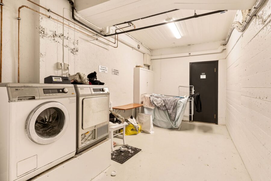 Laundry room wicker baskets folded towels washing machine