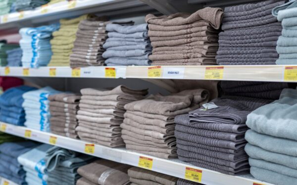 Simple linen closet refresh that keeps towels and sheets neat and easy to grab