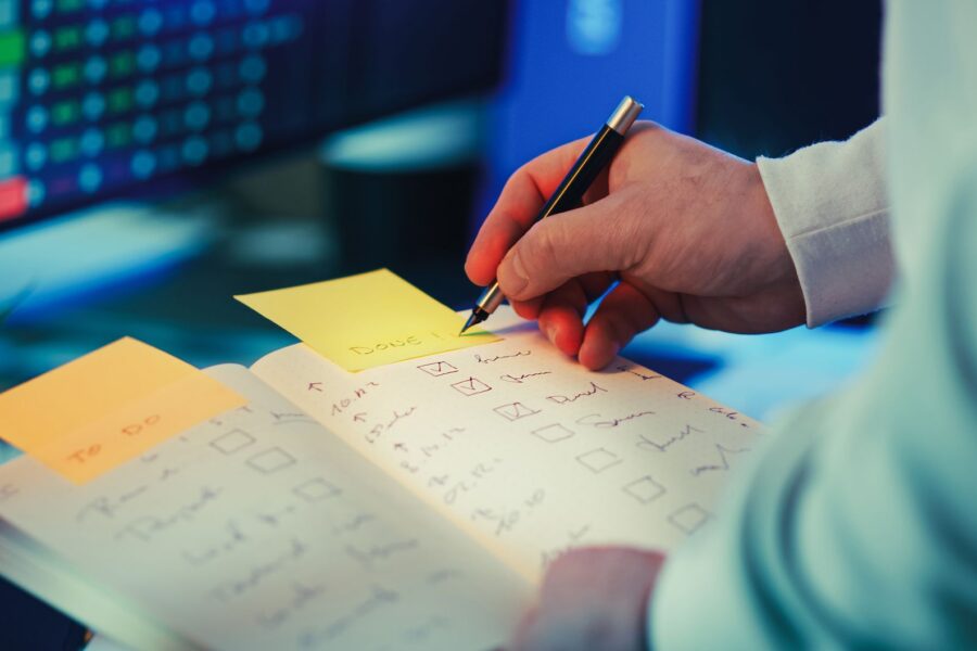 Person writing checklist